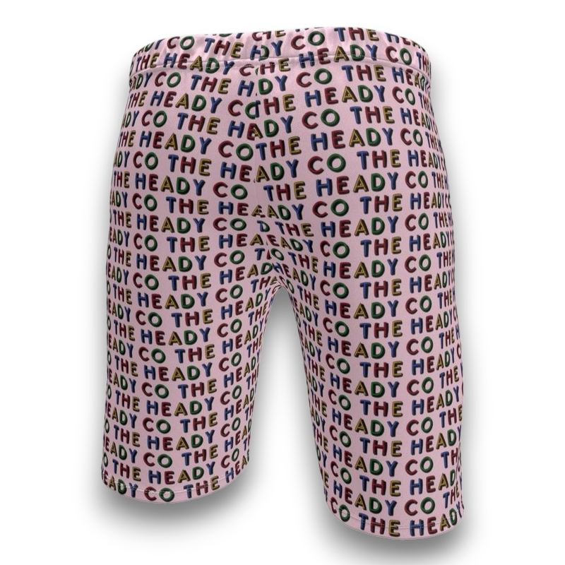 pink shorts with 'The Heady Co' text pattern