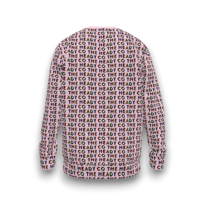 Colorful sweatshirt with 'The Heady Co' text pattern on a pink background