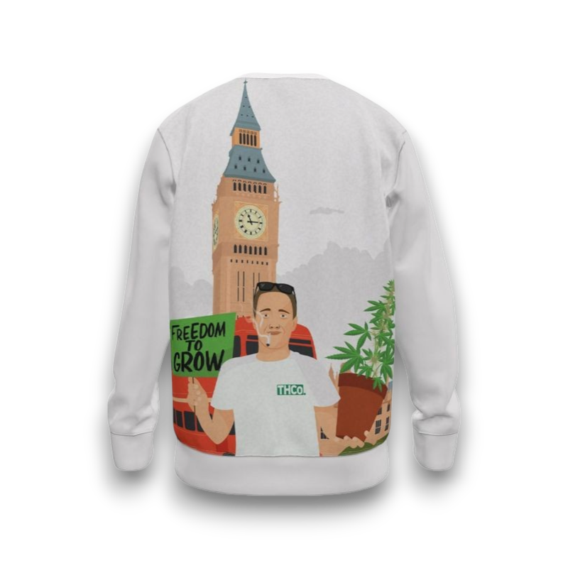 White sweatshirt with graphic design of a person holding a plant, Big Ben, and text 'Freedom to Grow'.