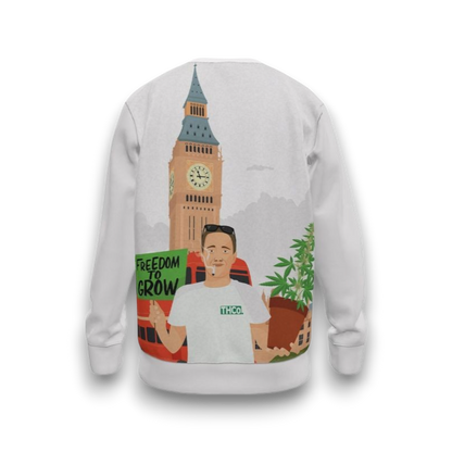 White sweatshirt with graphic design of a person holding a plant, Big Ben, and text 'Freedom to Grow'.