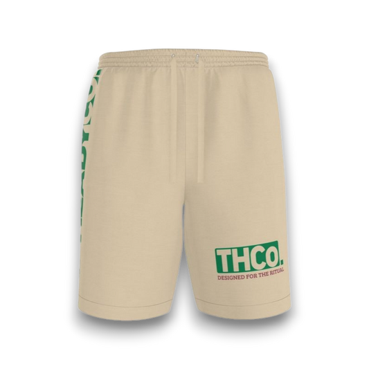 Beige shorts with green branding 