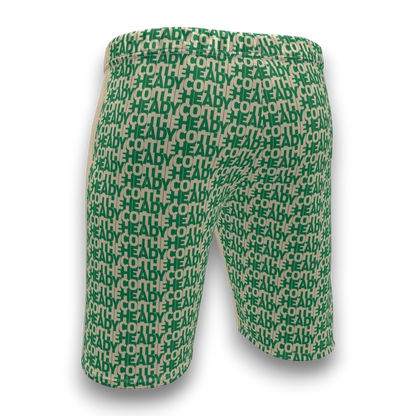 Green and beige shorts with 'HEADY' pattern