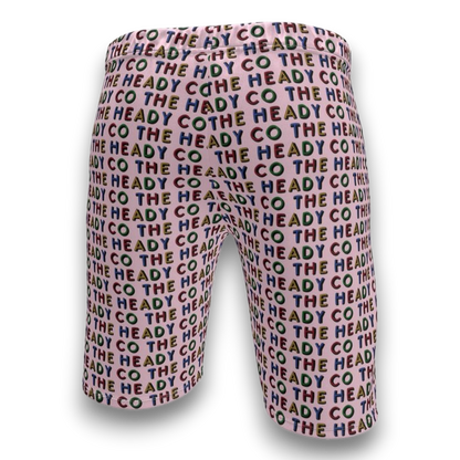 pink shorts with 'The Heady Co' text pattern 