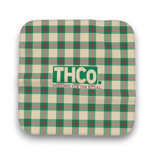 Green and beige plaid microfibre cloth with 'THCO.' logo 