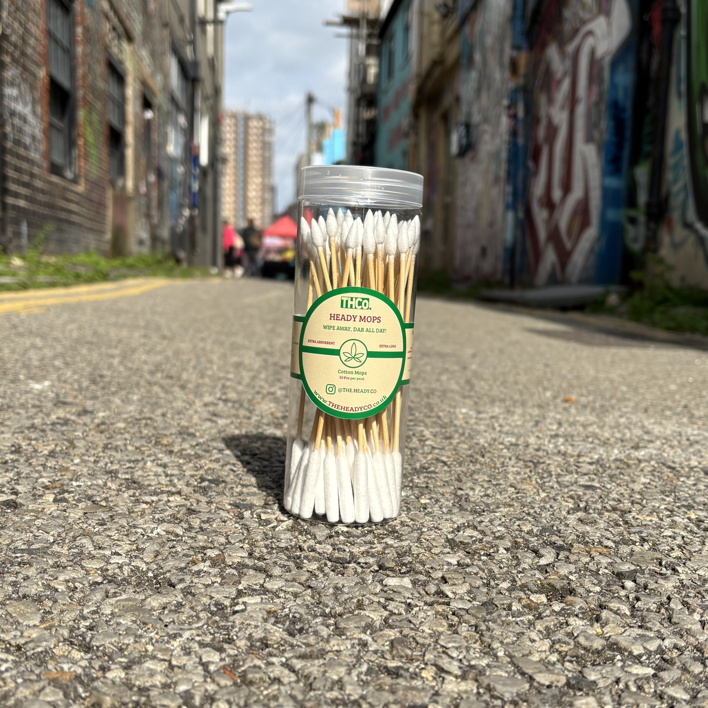 A container of THCo. The Heady Co. Heady Mops in a sunny Brighton Street